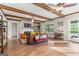 Spacious living room with hardwood floors, ceiling beams, and a cozy fireplace at 157 Waterlace Way, Fayetteville, GA 30215