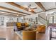 Expansive living room featuring hardwood floors, exposed beams, and an open staircase at 157 Waterlace Way, Fayetteville, GA 30215