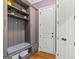 Well-organized mudroom with custom storage, bench seating, and stylish design for efficient entry at 157 Waterlace Way, Fayetteville, GA 30215