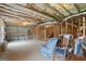 Unfinished basement area with concrete flooring and exposed ceiling beams at 3950 Chattahoochee Rd, Cumming, GA 30041