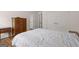 Spacious bedroom with wood floors, a large bed, closet, and ample storage space at 3950 Chattahoochee Rd, Cumming, GA 30041