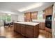 Charming kitchen featuring wood cabinets, a spacious island, and stainless steel appliances at 3950 Chattahoochee Rd, Cumming, GA 30041