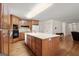 Spacious kitchen featuring an island, updated appliances, and a seamless flow to living areas at 3950 Chattahoochee Rd, Cumming, GA 30041