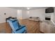 Spacious living room featuring hardwood floors and a cozy seating area at 3950 Chattahoochee Rd, Cumming, GA 30041