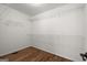 Spacious walk-in closet featuring hardwood floors and wire shelving for ample storage at 3950 Chattahoochee Rd, Cumming, GA 30041