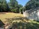 The house has a level backyard that has been recently mowed at 5431 S Lake Dr, Douglasville, GA 30135
