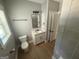 This bathroom features a sleek vanity, toilet, and doorway to the shower at 5431 S Lake Dr, Douglasville, GA 30135