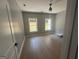 Comfortable bedroom featuring hardwood floors, a neutral color scheme, and natural light at 5431 S Lake Dr, Douglasville, GA 30135