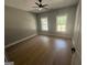 Spacious bedroom featuring hardwood floors and two bright windows at 5431 S Lake Dr, Douglasville, GA 30135