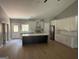 Modern kitchen featuring white cabinets, an island, and wood flooring at 5431 S Lake Dr, Douglasville, GA 30135