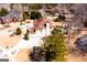 Aerial view shows the back of a house, a three-car garage, and a large yard in a residential area at 1214 Greenridge Ln, Lithonia, GA 30058