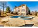Lovely backyard with an in-ground swimming pool and jacuzzi, ideal for summer fun and relaxation at 1214 Greenridge Ln, Lithonia, GA 30058