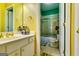 Bathroom featuring yellow walls, double sinks and a toilet at 1214 Greenridge Ln, Lithonia, GA 30058