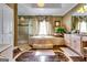 Bathroom with soaking tub, glass shower, vanity, and marble floors at 1214 Greenridge Ln, Lithonia, GA 30058