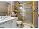 Well-lit bathroom with a glass-enclosed shower and a vanity with modern fixtures at 1214 Greenridge Ln, Lithonia, GA 30058