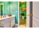 Bathroom featuring green walls, double sinks and a toilet at 1214 Greenridge Ln, Lithonia, GA 30058