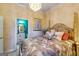 Comfortable bedroom with chandelier, en-suite bathroom and a four poster bed with decorative pillows at 1214 Greenridge Ln, Lithonia, GA 30058