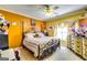 Cozy bedroom with a decorative iron bed frame and colorful walls at 1214 Greenridge Ln, Lithonia, GA 30058