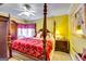 Bedroom featuring ceiling fan, carpet and four-poster bed at 1214 Greenridge Ln, Lithonia, GA 30058