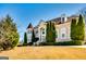 Elegant brick home showcasing mature trees and manicured landscaping on a sprawling green lawn at 1214 Greenridge Ln, Lithonia, GA 30058