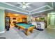 Entertaining game room complete with a billiards table, comfortable seating, and a stylish bar area for a fun space at 1214 Greenridge Ln, Lithonia, GA 30058
