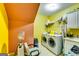 Well-equipped laundry room with modern washer and dryer, sink, and ample storage, providing convenience and efficiency at 1214 Greenridge Ln, Lithonia, GA 30058