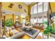 Bright living room showcasing high ceilings, tall windows, and hardwood flooring with comfortable furniture at 1214 Greenridge Ln, Lithonia, GA 30058