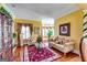 Open concept living room featuring hardwood floors, bay window, and neutral decor at 1214 Greenridge Ln, Lithonia, GA 30058