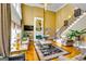 Bright living room with fireplace, hardwood floors, staircase, and neutral couches at 1214 Greenridge Ln, Lithonia, GA 30058
