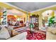 Open-concept living room with archways and seamless flow to dining area at 1214 Greenridge Ln, Lithonia, GA 30058