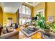 Impressive living room featuring high ceilings, tall windows, and decorative furniture at 1214 Greenridge Ln, Lithonia, GA 30058