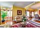 Open-concept living room with hardwood floors and bright, natural light at 1214 Greenridge Ln, Lithonia, GA 30058