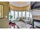 Cozy sitting area with large windows, fireplace, and hardwood floors at 1214 Greenridge Ln, Lithonia, GA 30058