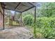 Backyard featuring a patio area, greenery, and metal staircase at 3232 Abbeywood Dr, Decatur, GA 30034