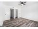 Bedroom featuring hardwood floors, ceiling fan and closet with sliding doors at 3232 Abbeywood Dr, Decatur, GA 30034