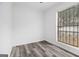 Bedroom featuring gray wood-look flooring and a window with privacy blinds at 3232 Abbeywood Dr, Decatur, GA 30034