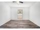 Bright bedroom with hardwood floors, ceiling fan and window with an outdoor view at 3232 Abbeywood Dr, Decatur, GA 30034