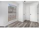 Bedroom with a window and gray wood-look flooring for a modern aesthetic at 3232 Abbeywood Dr, Decatur, GA 30034