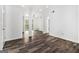 A bright living area is enhanced by dark gray wood floors and natural light at 3232 Abbeywood Dr, Decatur, GA 30034