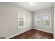 Bright bedroom with two windows, hardwood floors, and white trim at 1030 Westmoor Nw Dr, Atlanta, GA 30314