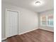This bedroom features hardwood floors, double door closet, and a double window for natural light at 1030 Westmoor Nw Dr, Atlanta, GA 30314