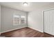 Cozy bedroom with hardwood floors, closet, and two windows for natural light at 1030 Westmoor Nw Dr, Atlanta, GA 30314