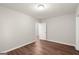 Spacious room with modern lighting, hardwood floors, and freshly painted walls at 1030 Westmoor Nw Dr, Atlanta, GA 30314
