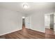Bright bedroom featuring hardwood floors, neutral walls, and a double door closet at 1030 Westmoor Nw Dr, Atlanta, GA 30314