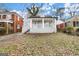 Charming house with a cozy front porch, white columns, and painted brick exterior at 1030 Westmoor Nw Dr, Atlanta, GA 30314