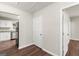 Hallway view showcasing hardwood floors, neutral paint and doorway views of the kitchen at 1030 Westmoor Nw Dr, Atlanta, GA 30314