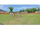 Expansive backyard featuring a wooden fence, play set, and plenty of room to run around at 17 Sawtooth Oak Dr, Moreland, GA 30259