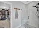 Elegant bathroom showcasing a glass shower, custom coat rack, and view to walk-in closet at 17 Sawtooth Oak Dr, Moreland, GA 30259