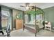 Unique bedroom with custom canopy bed with ivy, accent wall, and wood floors at 17 Sawtooth Oak Dr, Moreland, GA 30259