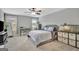 Bright bedroom with neutral color palette, featuring large windows and a ceiling fan at 17 Sawtooth Oak Dr, Moreland, GA 30259